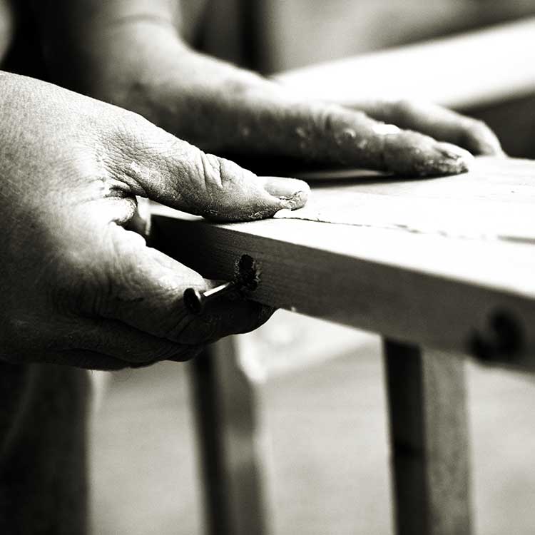 Craftsman making a wooden frame for a luxury sofa