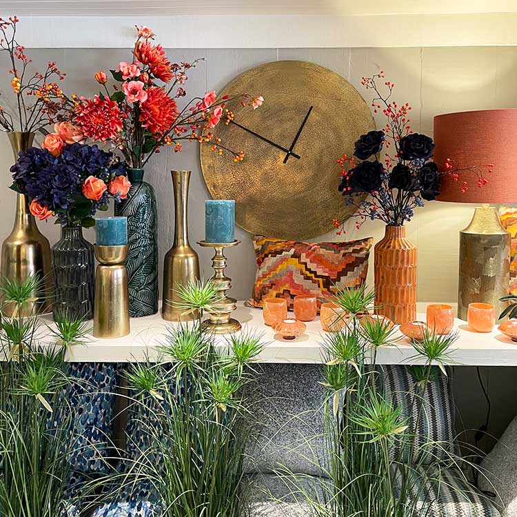 Display of tea lights, vases and candles at New England Home Interiors