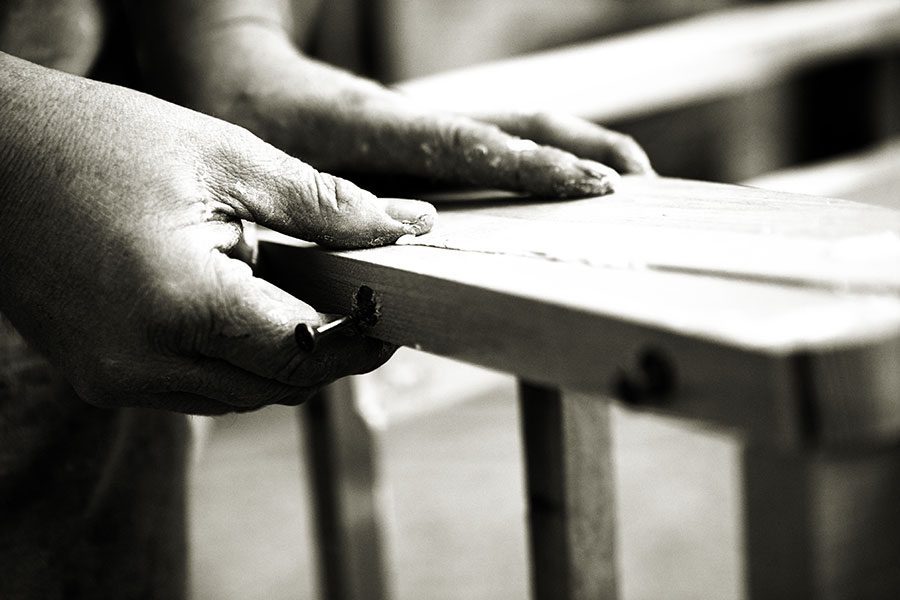 The frame of a quality sofa being constructed using hardwood and traditional woodworking methods