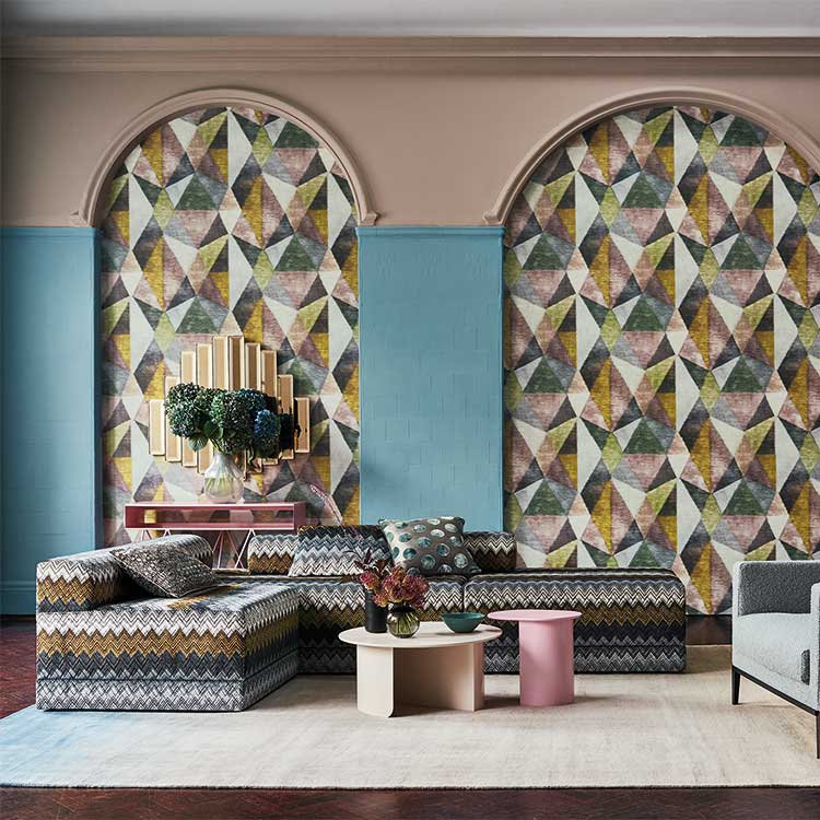Living room featuring luxury upholstery fabric with complimentary wallpaper within feature archess