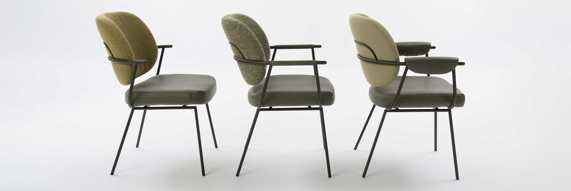 Bespoke dining chairs with different fabrics and arm styles