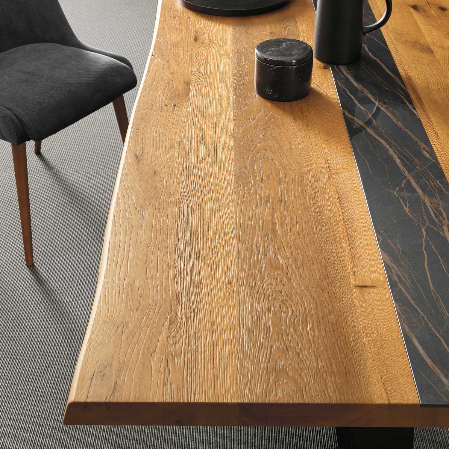 Oak bespoke dining table with natural edges and sintered stone centre panel