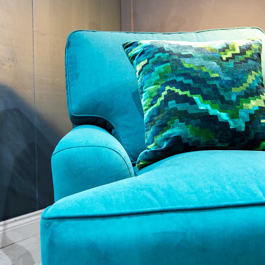 A bespoke sofa with luxury velvet pet proof fabric on display at the New England sofa store in Horsham