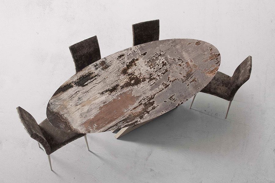 Oval sintered stone dining table with Dekton Trilium top