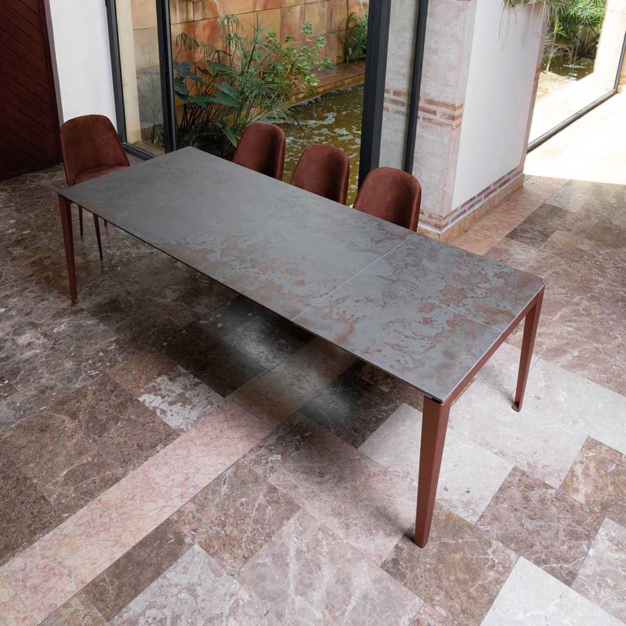 Vesuvius ceramic dining table with thin and stylish metal legs