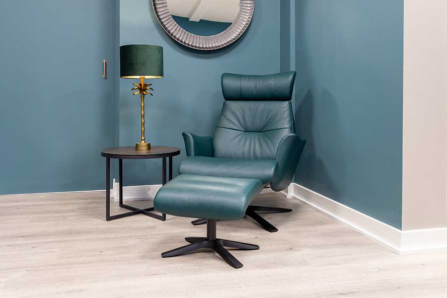 Beyoung leather reclining armchair and footstool in dark green leather