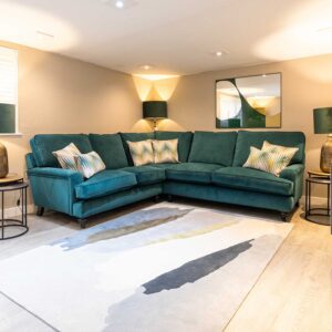 Winchester large corner sofa upholstered in blue velvet fabric