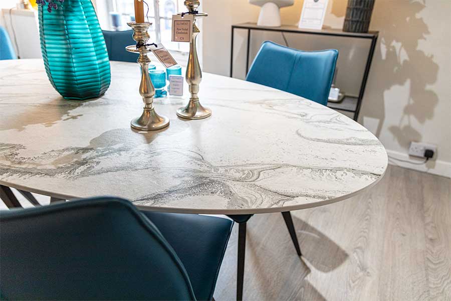 The stunning Cleveland oval modern dining table with white marble effect Dekton top