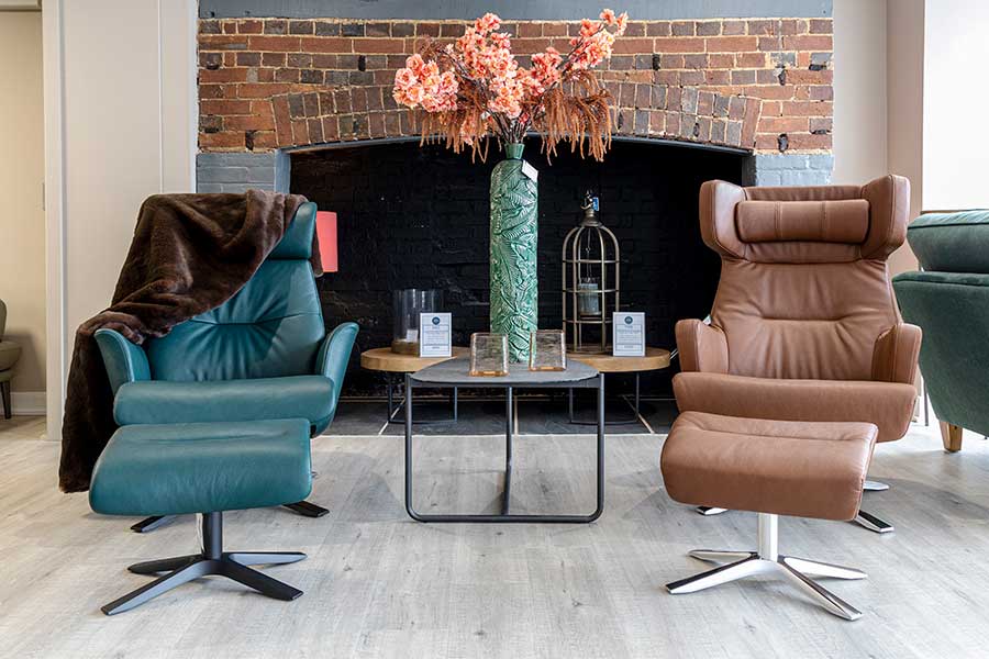 Luxury Conform leather recliner armchairs with matching footstools