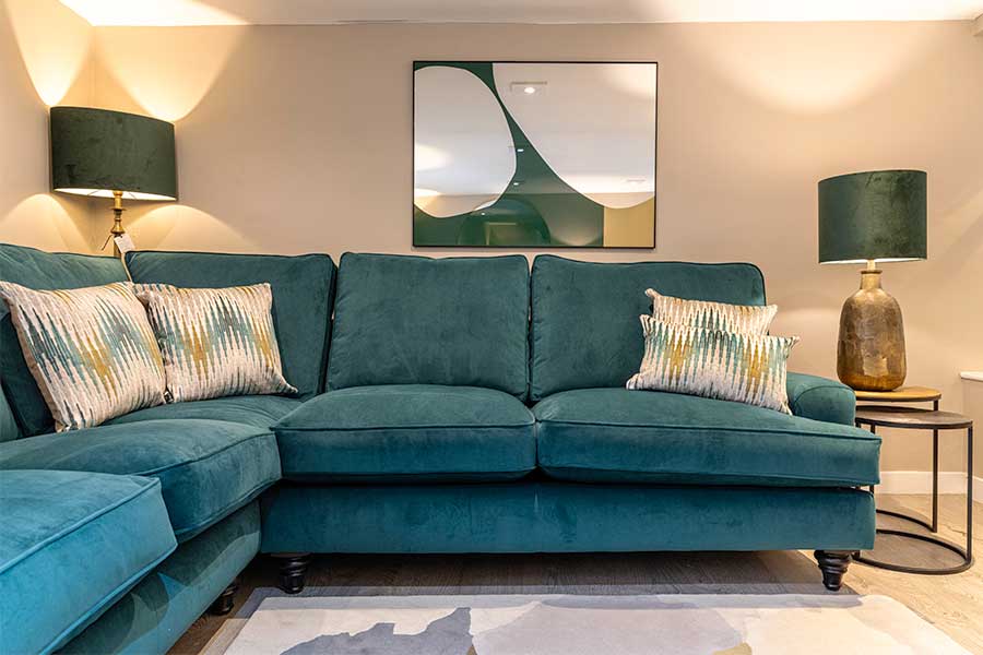 large Winchester corner sofa in teal velvet on display at New England Home Interiors in Horsham 