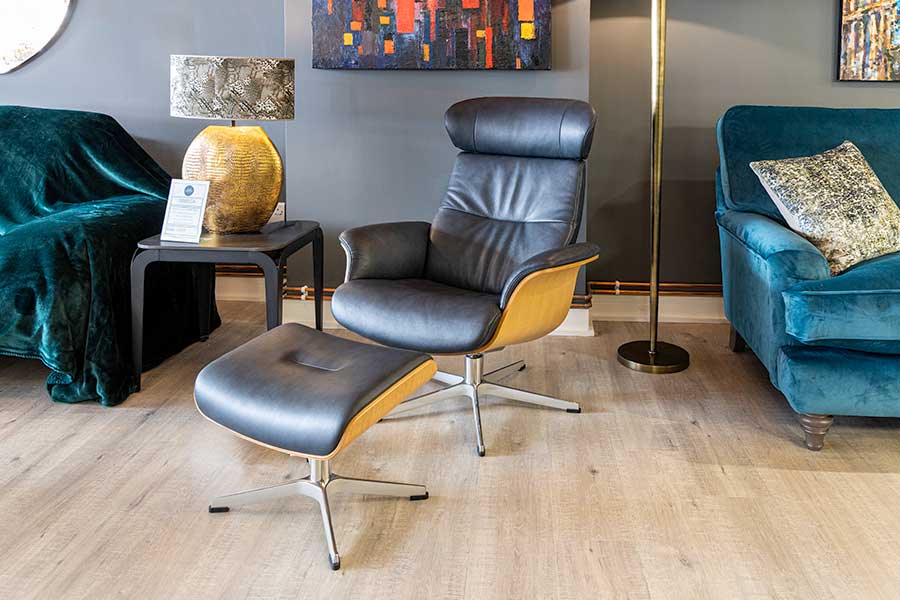 Conform Timeout modern leather recliner armchair and footstool in black leather with beech wood frame