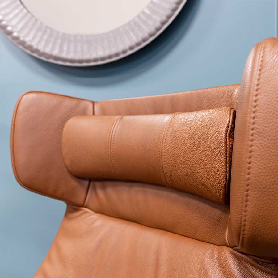 The Conform Myplace modern armchair has a sticking wing-back design with integrated headrest 