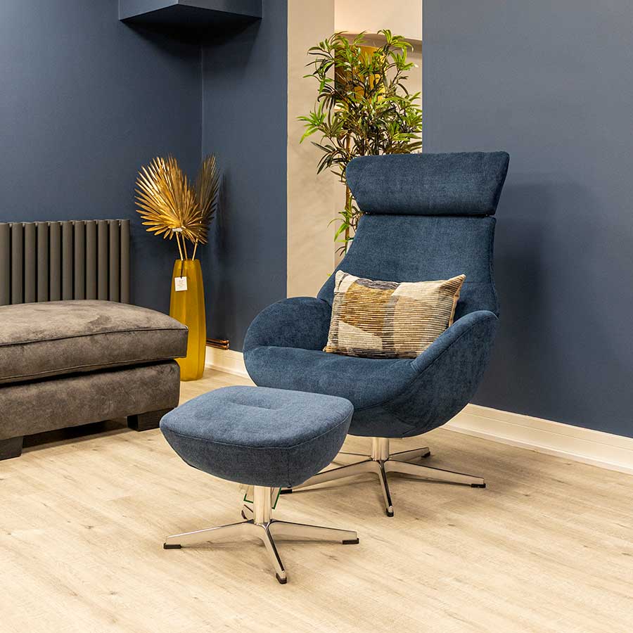 A conform armchair is shaped like a glove. This one is trimmed in blue cotton fabric