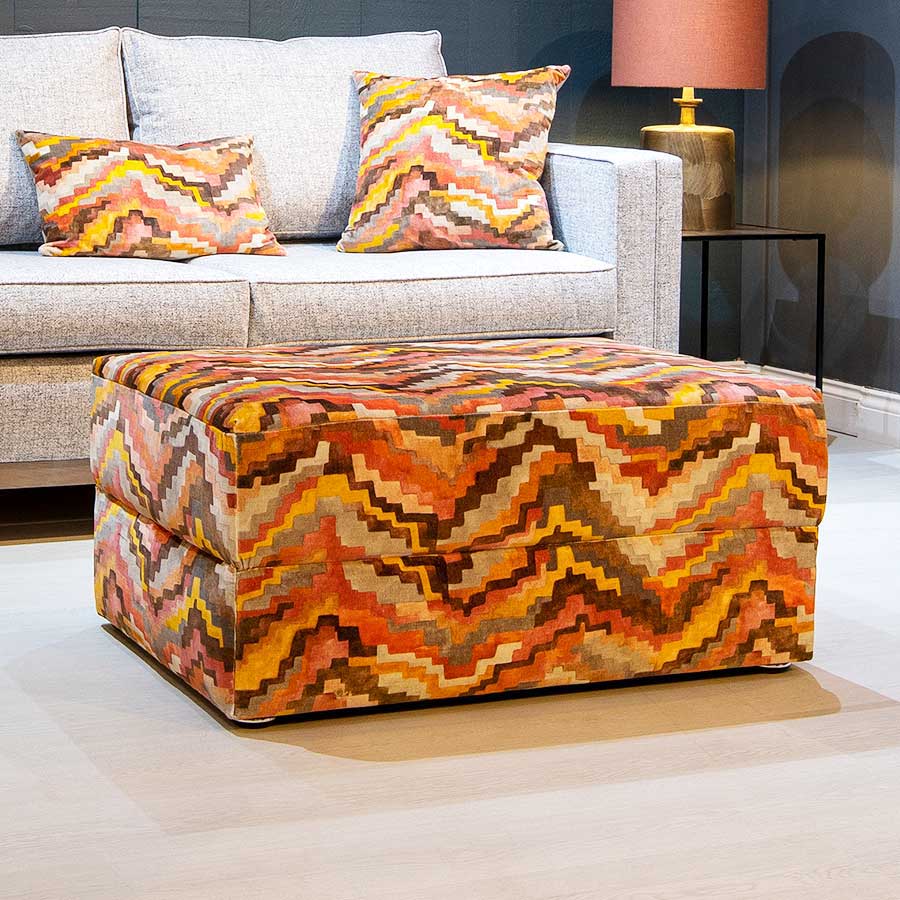 A bespoke orange footstool with storage made by New England Home Interiors